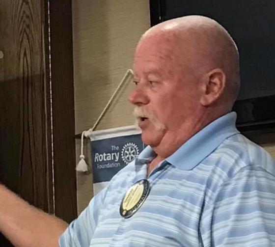 TURK SPEAKS AT ROTARY MEETING